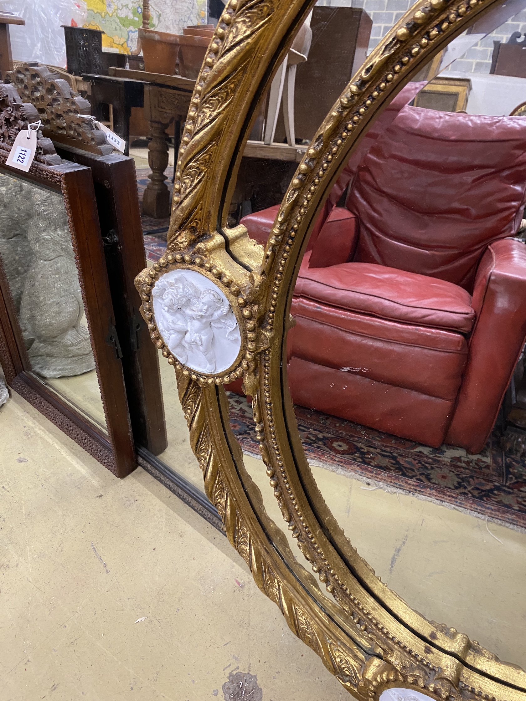 A Victorian style gilt composition and faux marble wall mirror, width 100cm, height 144cm